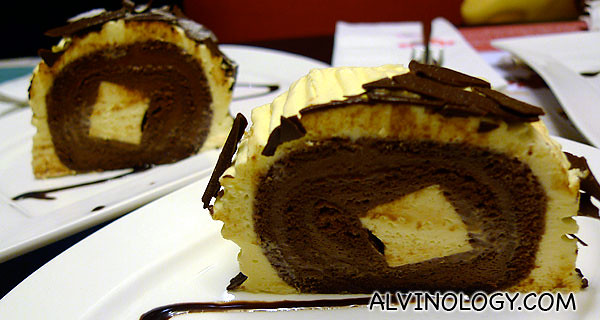 Two slices of cheese and chocolate log cake