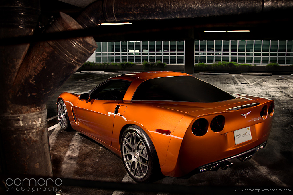 Atomic Orange Corvette with aftermarket wheels... by... 