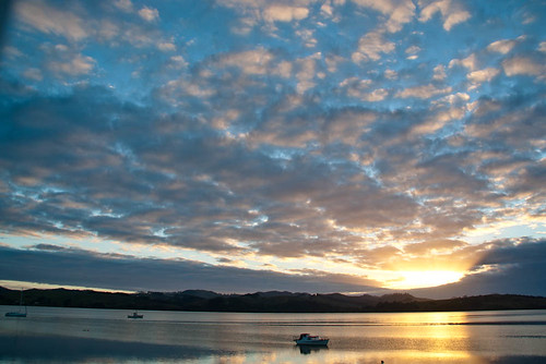 light newzealand sky clouds sunrise reflections boats hills nz northisland mangonui