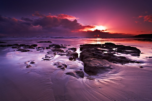 uk pink england sky sun seascape beach nature beautiful sunrise reflections landscape seaside sand rocks colorful day purple cloudy scenic explore northsea scarborough colourful sunrays southbay northyorkshire eastcoast canon1740f4 flickrexplore canon1dsmkii explored flickrexplored cokinnd hitechreversendgrad markmullenphotography