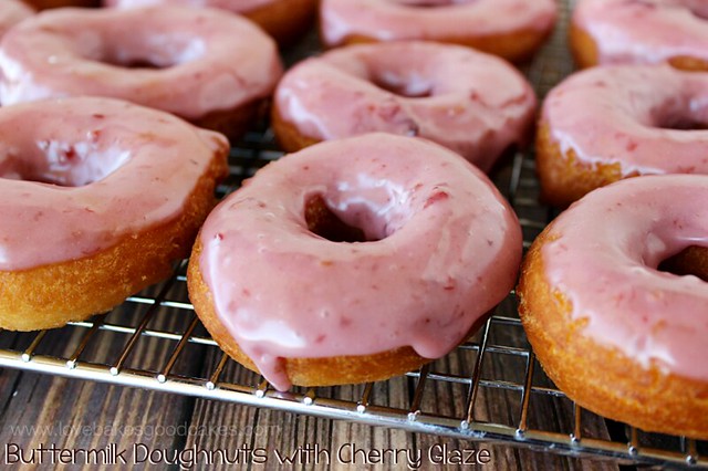 Buttermilk Doughnuts with Cherry Glaze on a cooling rack.