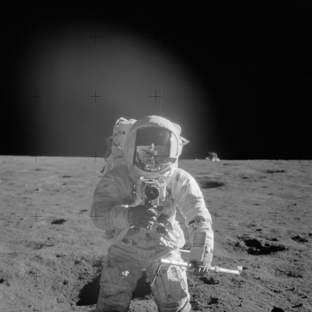 Apollo 12 Mission image - Astronaut Charles Conrad Jr., Apollo 12 commander, using a 70mm handheld Haselblad camera from Flickr via Wylio