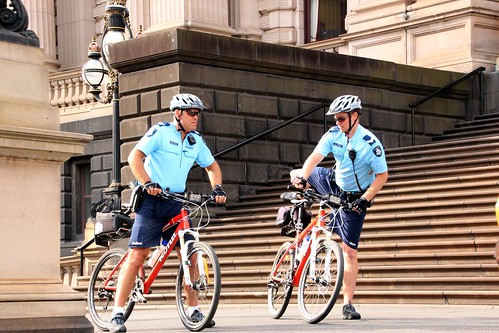 Two members of police bicycle squad at Spring Street - Melbourne May Day is May 1, 2012
