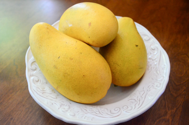 Mangoes arranged on a plate.