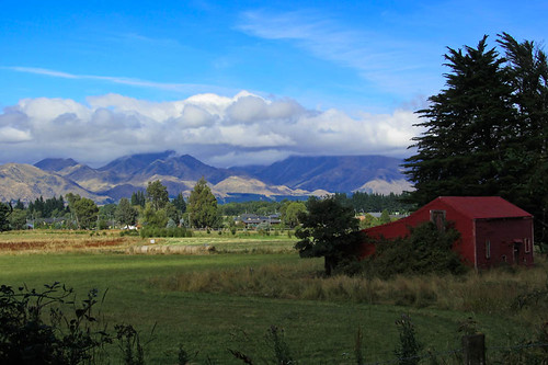 trees light newzealand sky mountains building grass clouds gate hills fields southisland ban hanmersprings padocks