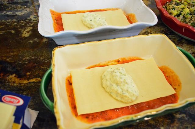 A lasagna sheet laid on top of the marinara coated loaf pan with ricotta mixture added to the very top.