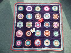 This is a gorgeous Blanket. Circles within Squares! Beautiful colours and so kind of you thank you joyce28!