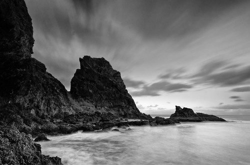 longexposure light sea newzealand sky blackandwhite bw seascape beach water monochrome rock clouds sunrise dawn coast nikon auckland filter northisland westcoast bethellsbeach nd110