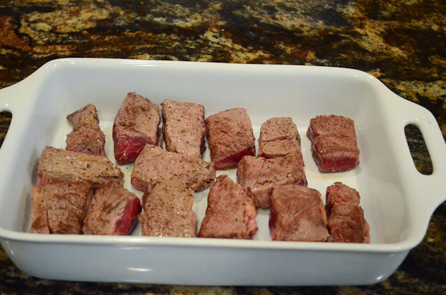 The browned beef is placed into a casserole dish.