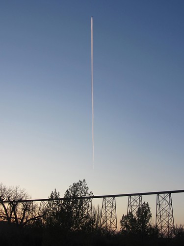 bridge sunset sky airplane contrail lethbridge