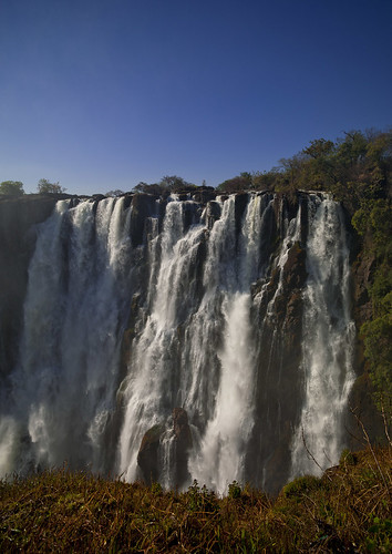 africa nature vertical landscape outside outdoors exterior bluesky nopeople victoriafalls cascade zambia colorphoto livingstone southernafrica 686
