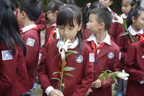 Student presenting flower