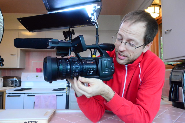 Erik Dinnel holding his video camera.