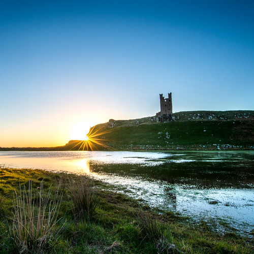 castle reflections dawn northumberland sunburst dunstanburgh dunstanburghcastle