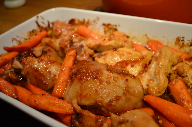 glazed orange hoisin chicken with carrots in baking dish