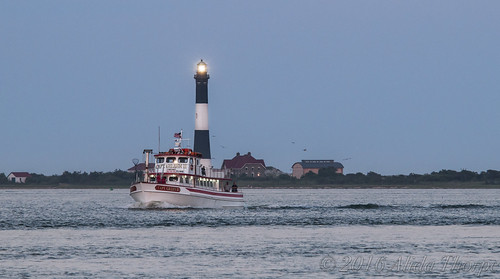Fishing Boat and Lighthouse