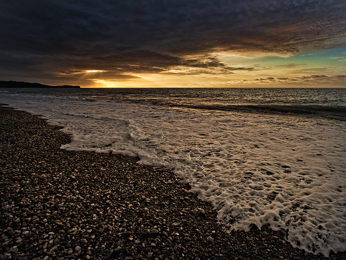 sunset west beach island coast bravo stones south wave foam nz gillespies