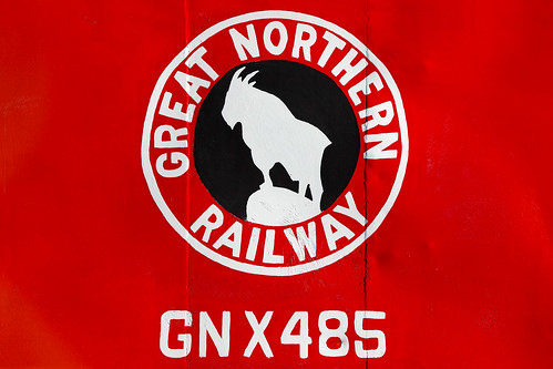 old railroad travel red black detail history silhouette sign horizontal closeup museum contrast train emblem circle logo typography design fairgrounds montana track commerce mt bright sold painted side rail nobody visit line stages caboose equipment business company railcar havre american transportation signage historical locomotive lettering copyspace glaciernationalpark insignia sideview gn centered bnsf americanwest mountaingoat outofbusiness northernmontana canadianborder defunct mainline designelement hillcounty greatnorthern greatnorthernrailway colorimage transcontinentalrailroad railsystem hiline bnsfrailway greatnorthernempirebuilder motorfreight toddklassy greatnorthernfair montanamagazinephotographers stpaulpacificrailroad gnx485