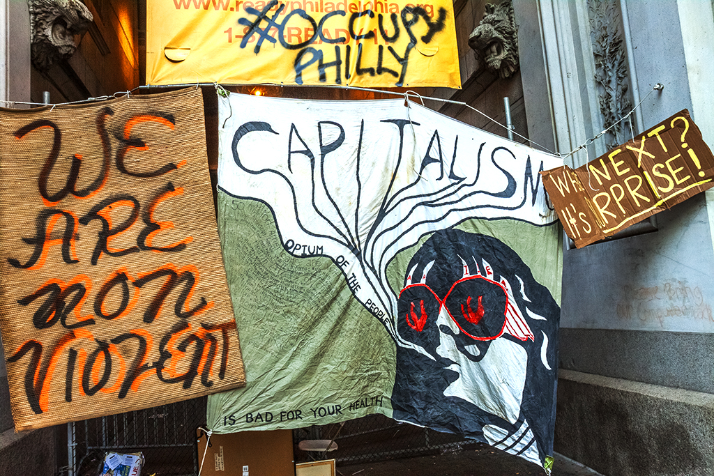 CAPITALISM-OPIUM-OF-THE-PEOPLE-banner--Center-City