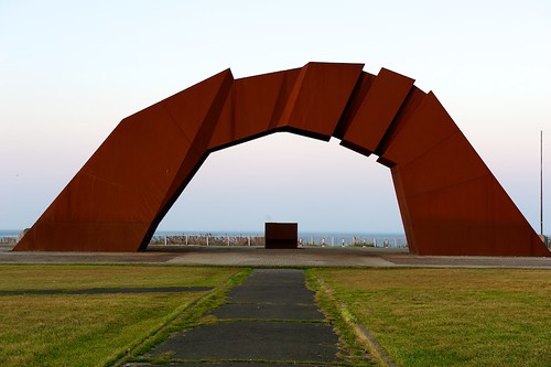 ocean sunset monument grass fence arch outdoor