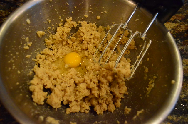 The cream, butter, brown and white sugar mixture with a raw egg added on top.
