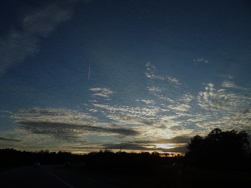 sunset sky color clouds contrail jet poles