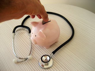 Photo:Stethoscope and piggy Bank By:401(K) 2013