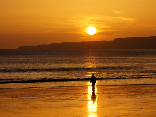 morning sea orange sun reflection beach water silhouette sunrise seaside sand glow sad walk cliffs walker single isolation lonely stroll