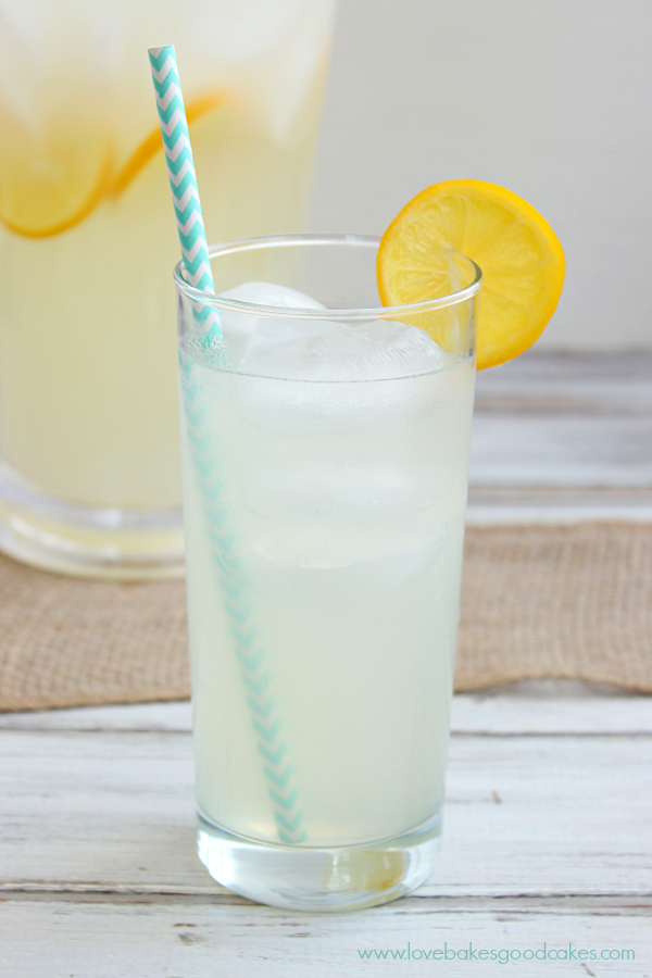 Perfect Lemonade in a glass with a slice of lemon.