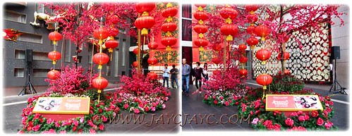 CNY 2012 decor: giant cherry blossom trees and red lanterns at entrance to Pavilion KL #2/2