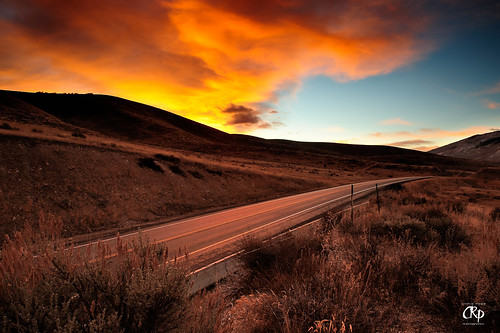 red orange cloud yellow sunrise utah desert hill brush sage