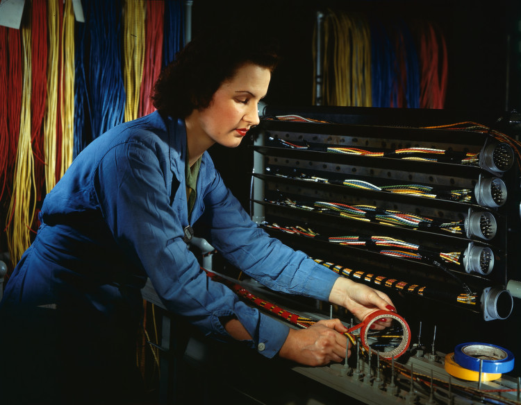 [Woman taping wire, Chrysler Corporation]