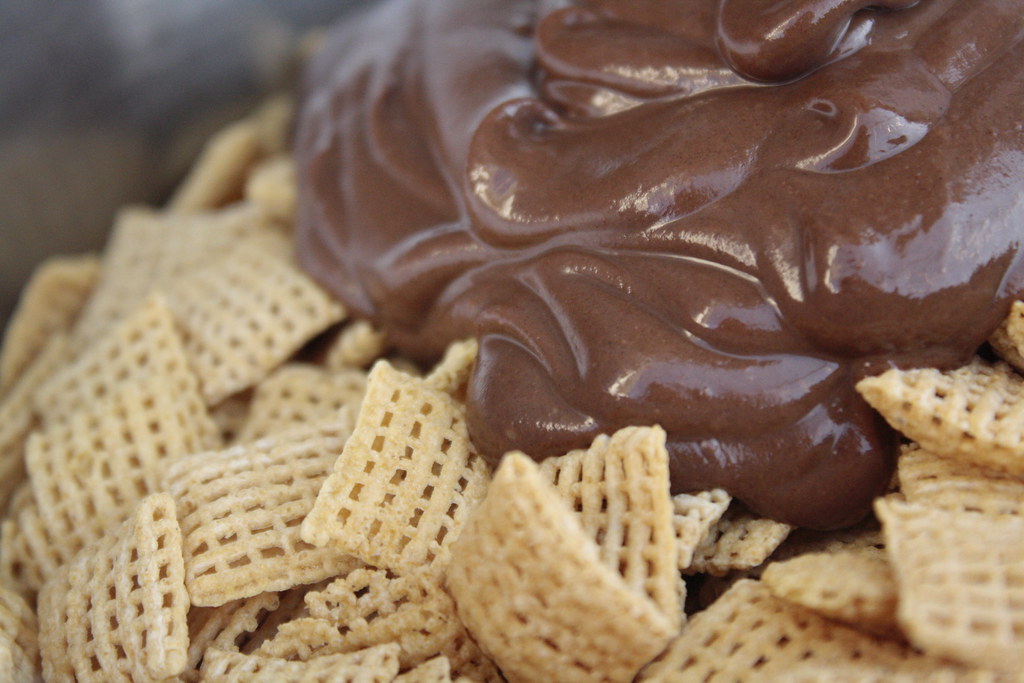 Chocolate poured on Chex