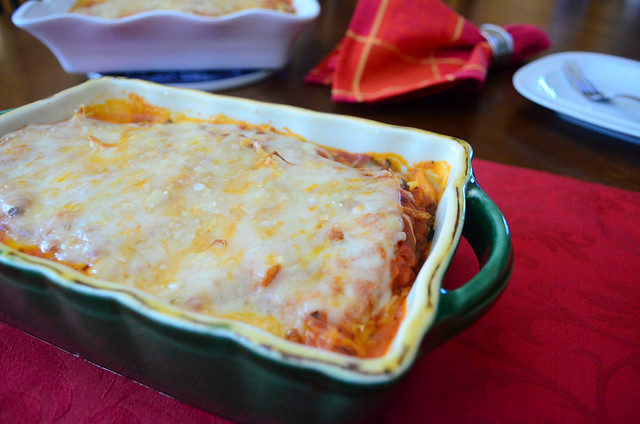 Lasagna in a loaf pan that has just finished cooking.