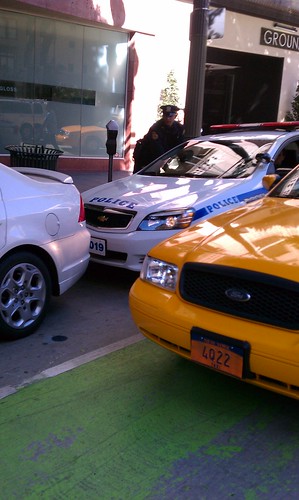 Fake NYPD and NY taxi cabs block Spring Street bike lane during film shoot