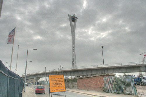 Pylon with test cables and road closure sign