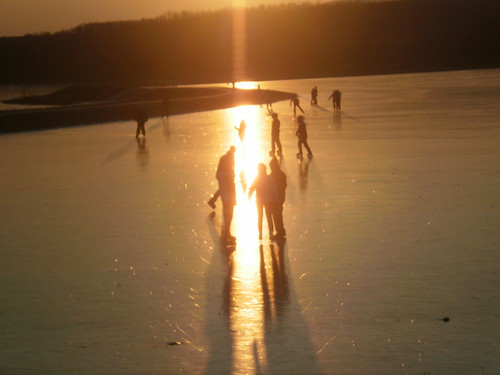 winter sunset lake ice skating skaters freeze