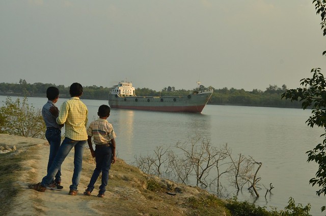 While big cargo ships like these, on their way to Bangladesh, can use this route, local fishermen are not allowed to use machine-powered boats.JPG