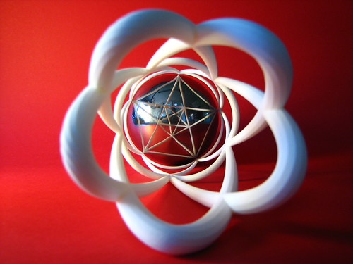 3D anamorphosis with a spherical mirror and a distorted shape put on a cylinder