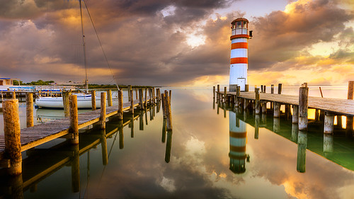 sunset lighthouse lake reflection nature water clouds pier boat jetty beacon neusiedl reflectioninwater seewinkel