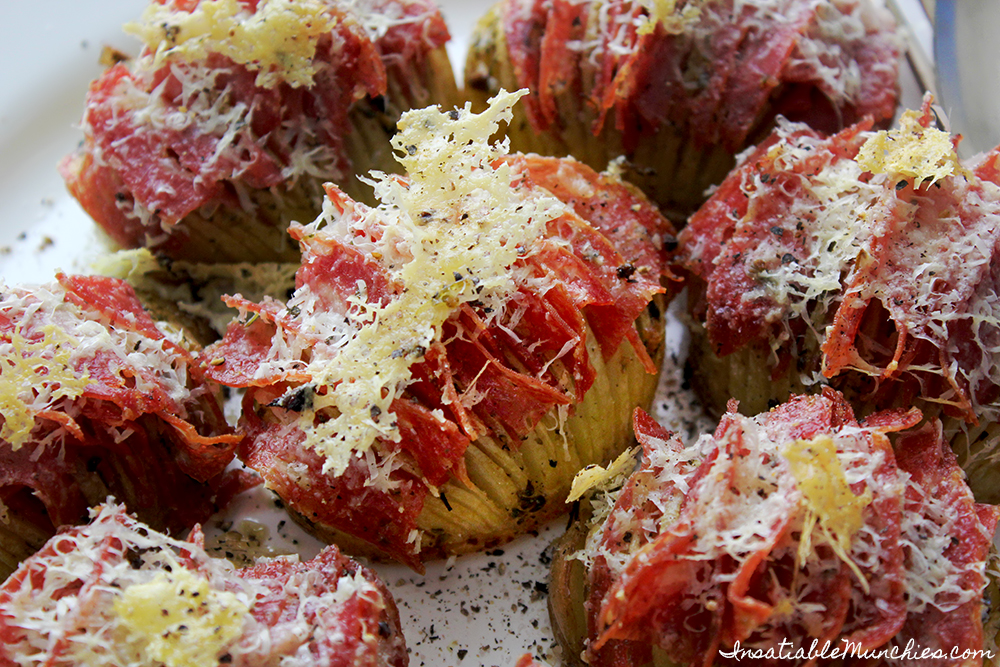 Hasselback potatoes, stuffed with salami and covered in pecorino cheese. 