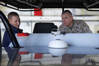 Marine Corps Sgt. Maj. Bryan Battaglia, senior enlisted advisor to the Chairman of the Joint Chiefs of Staff, explores the instrument panel of the Midnight Express, a tactical training boat, during the SEAC's visit to Helicopter Interdiction Tactical Squadron here in Jacksonville April 16. During the SEAC's visit, he met gained an understanding for the mission HITRON conducts in Jacksonville and down range. (DoD photo by Army Master Sgt. Terrence L. Hayes)