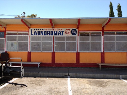 street city windows orange building sign architecture self bench landscape waiting afternoon view painted parking scenic dry clothes clean business sidewalk wash laundry service parked cleaner stockton spincycle landromat