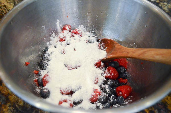 Sugar and cornstarch poured on top of the berries.