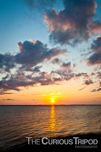 ocean blue sunset orange beach water grass clouds bay duck northcarolina marsh outerbanks obx
