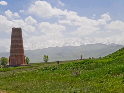 park trees snow cold tower monument grass landscape peak kyrgyzstan bishkek buranatower alatoomountains