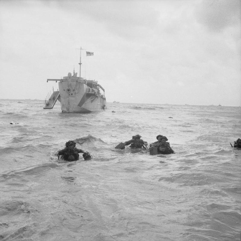 Troops wading ashore from an LCI(L) on Queen beach, Sword area, 6 June 1944.