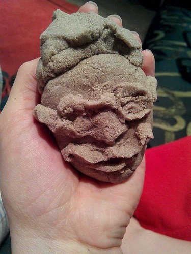 Face out of kinetic sand
