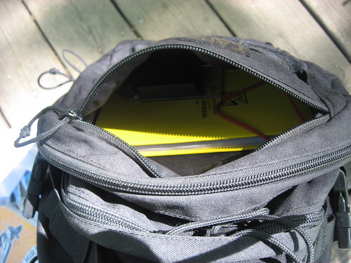 CamelBak Mil Tac HAWG backpack: open front pocket with yellow notebook 