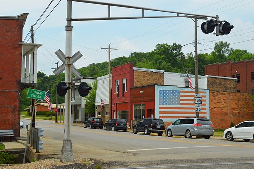 small town sunday creek state route corning ohio train signal street tracks flag american brick building mural
